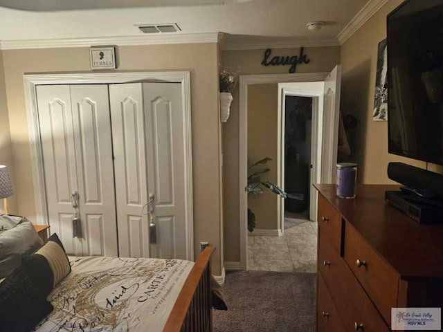 2104 Tomatillo Dr, Weslaco, TX 78596 - bedroom with a closet, ornamental molding, carpet, and baseboards