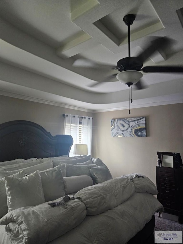 2104 Tomatillo Dr, Weslaco, TX 78596 - carpeted bedroom with crown molding, a tray ceiling, and a ceiling fan