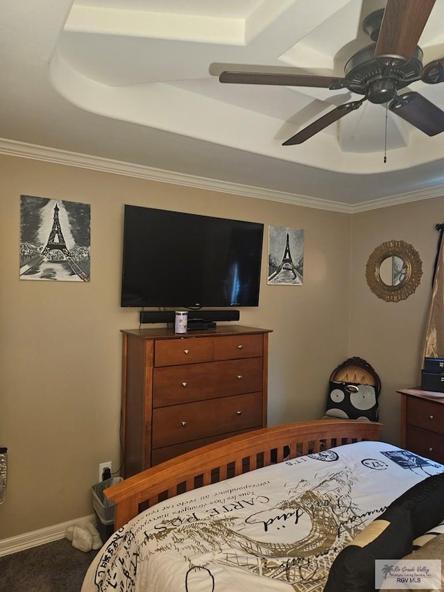 2104 Tomatillo Dr, Weslaco, TX 78596 - bedroom featuring ornamental molding, carpet flooring, a tray ceiling, baseboards, and a ceiling fan