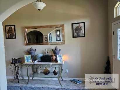 2104 Tomatillo Dr, Weslaco, TX 78596 - detailed view of baseboards, arched walkways, and an office area