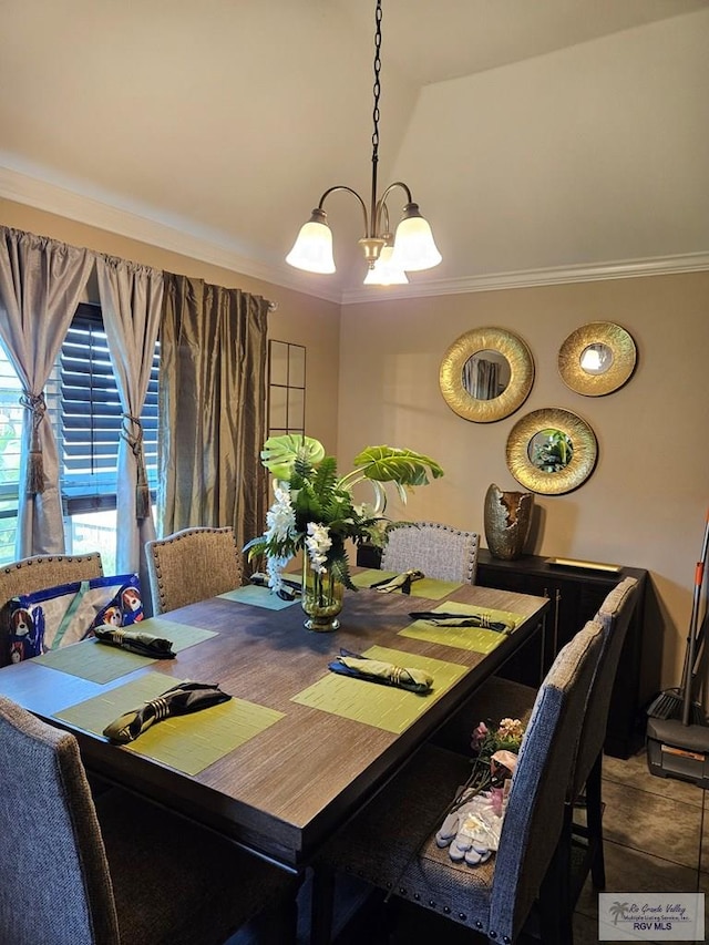 2104 Tomatillo Dr, Weslaco, TX 78596 - dining area with a chandelier and crown molding
