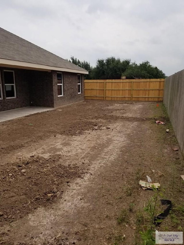 2104 Tomatillo Dr, Weslaco, TX 78596 - fenced backyard with a patio