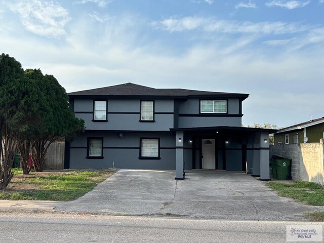 view of front facade with a carport