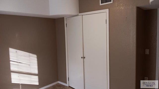 unfurnished bedroom featuring a closet