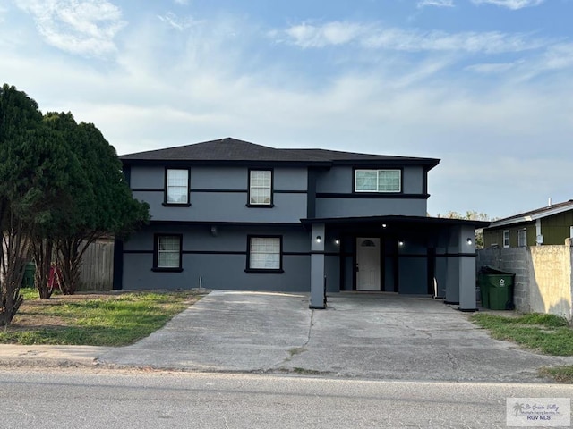 view of front of home with a carport