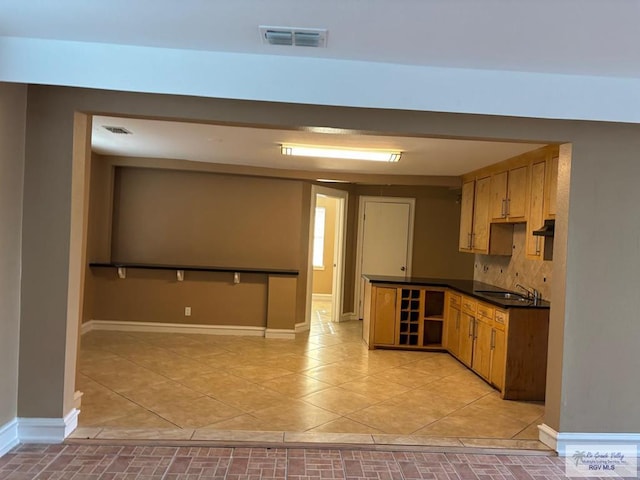 kitchen with light tile patterned flooring and sink