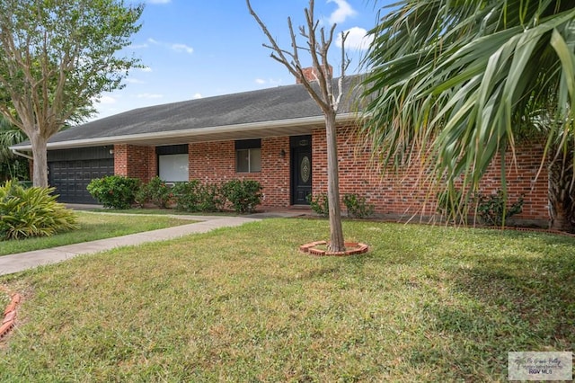 ranch-style home with a garage and a front lawn