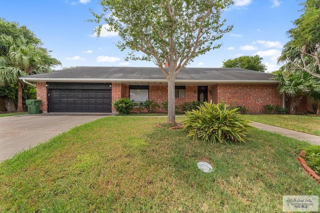 ranch-style home featuring a front yard and a garage