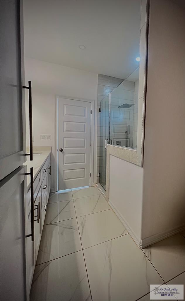 bathroom with vanity and an enclosed shower