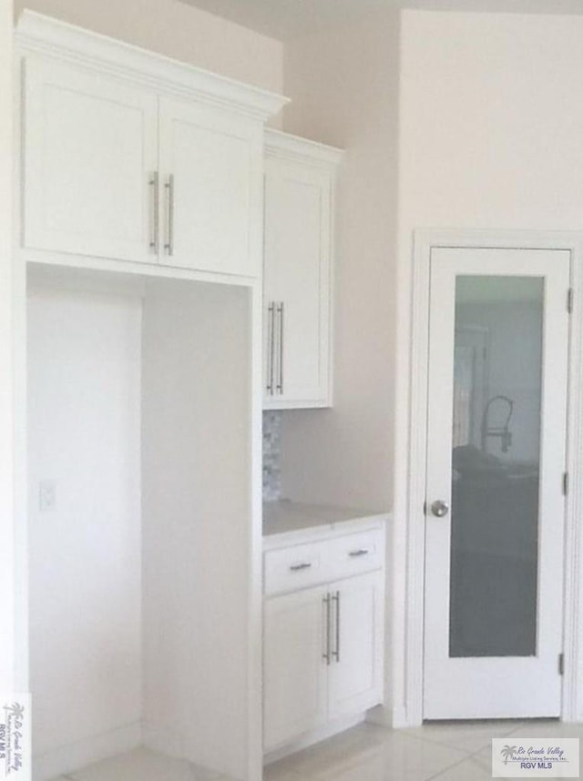 interior space featuring white cabinets