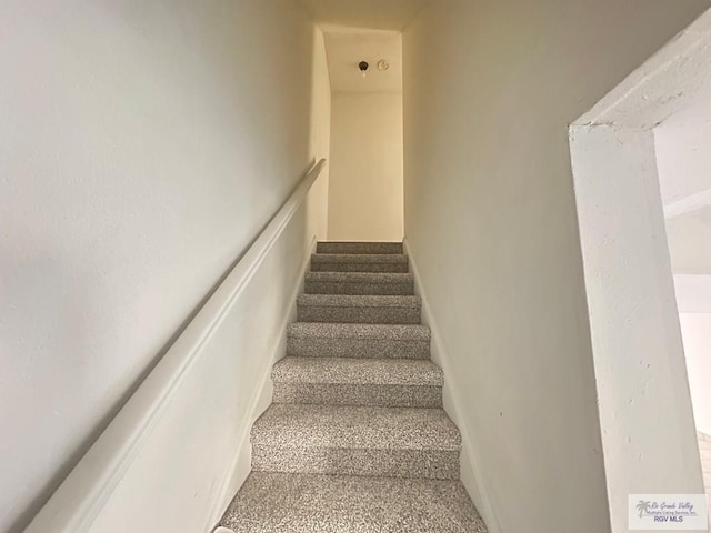 504 Galveston Rd, Brownsville, TX 78521 - stairway featuring baseboards