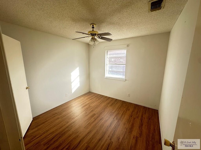 504 Galveston Rd, Brownsville, TX 78521 - spare room with a textured ceiling, ceiling fan, wood finished floors, and visible vents