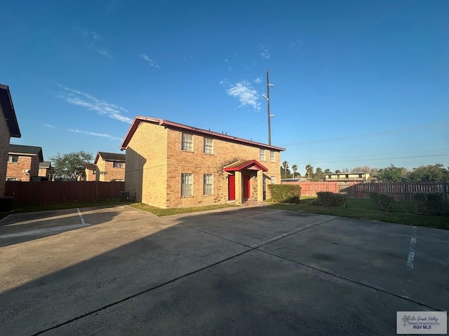 504 Galveston Rd, Brownsville, TX 78521 - exterior space featuring brick siding and fence