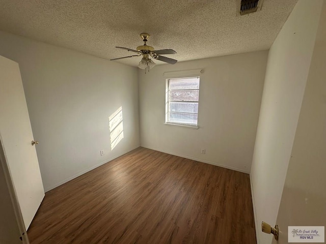 504 Galveston Rd, Brownsville, TX 78521 - spare room featuring a ceiling fan, a textured ceiling, visible vents, and wood finished floors