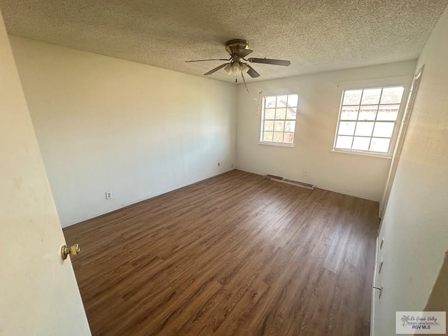504 Galveston Rd, Brownsville, TX 78521 - empty room featuring a textured ceiling, ceiling fan, and wood finished floors