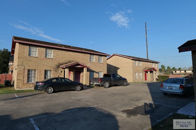 504 Galveston Rd, Brownsville, TX 78521 - uncovered parking lot featuring fence
