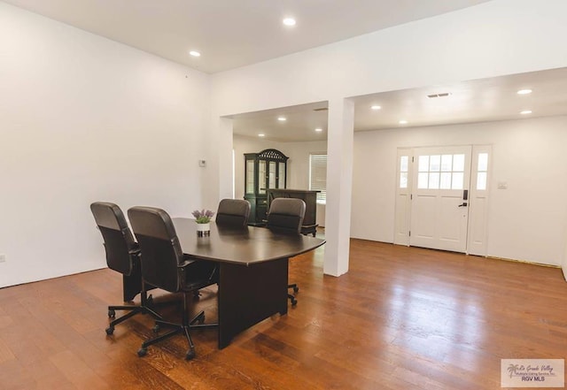 dining space with dark hardwood / wood-style floors