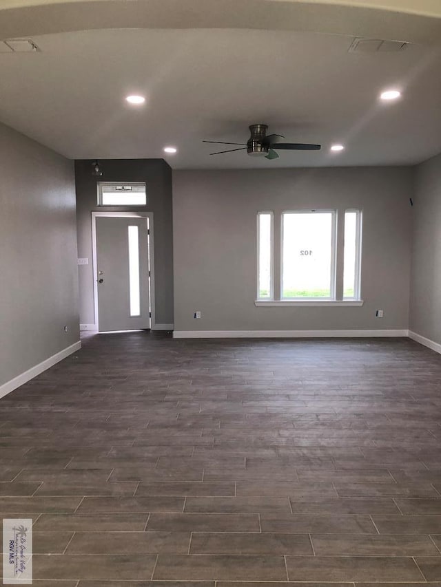 foyer with ceiling fan and dark hardwood / wood-style flooring