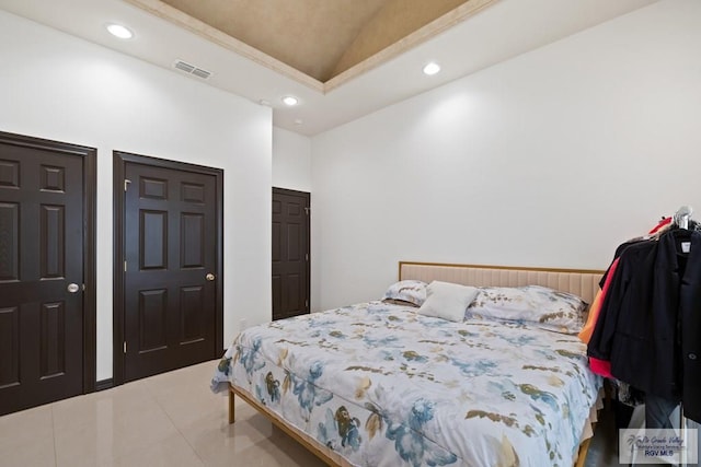 bedroom featuring tile patterned flooring and lofted ceiling