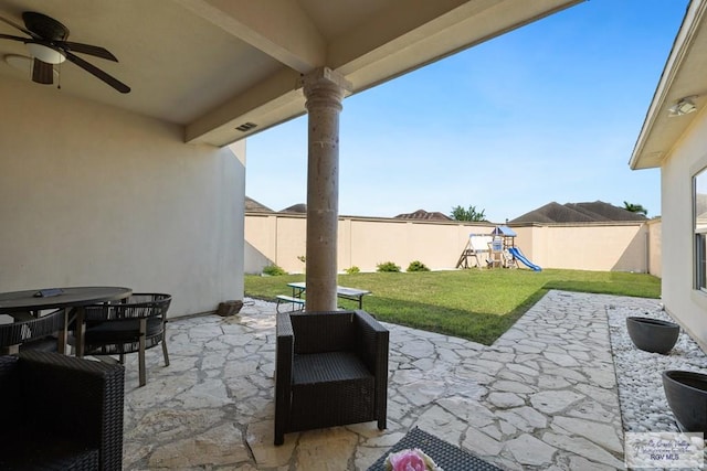 view of patio / terrace featuring ceiling fan and a playground