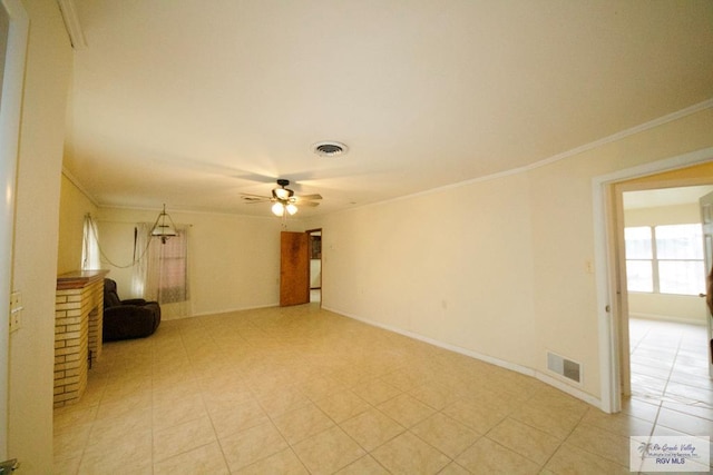 unfurnished living room with visible vents, crown molding, and ceiling fan