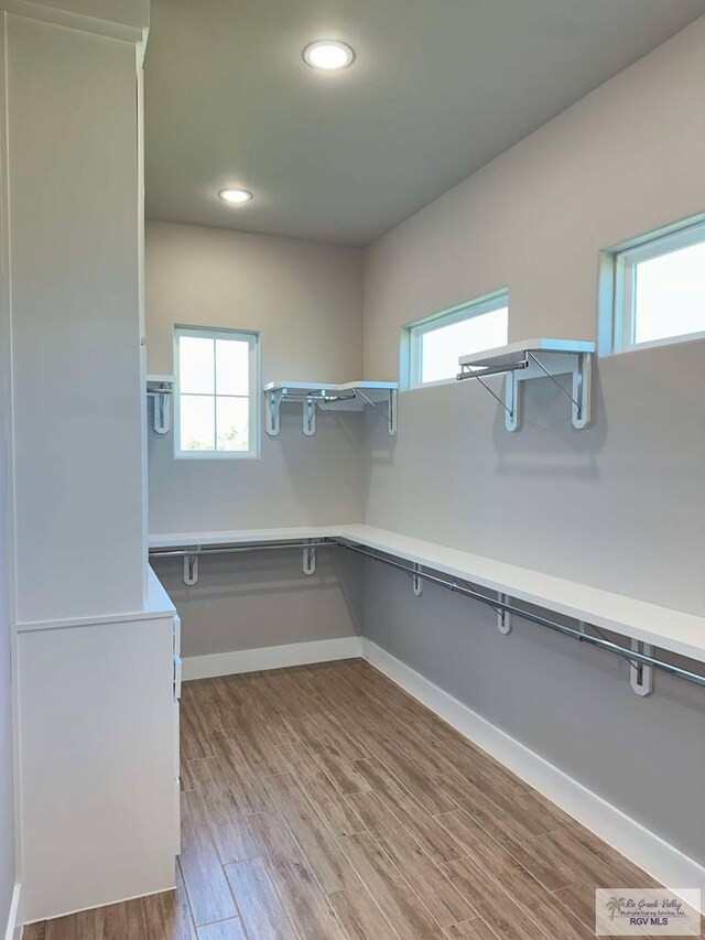 3414 Bryan Dr, Harlingen, TX 78550 - spacious closet featuring wood finished floors