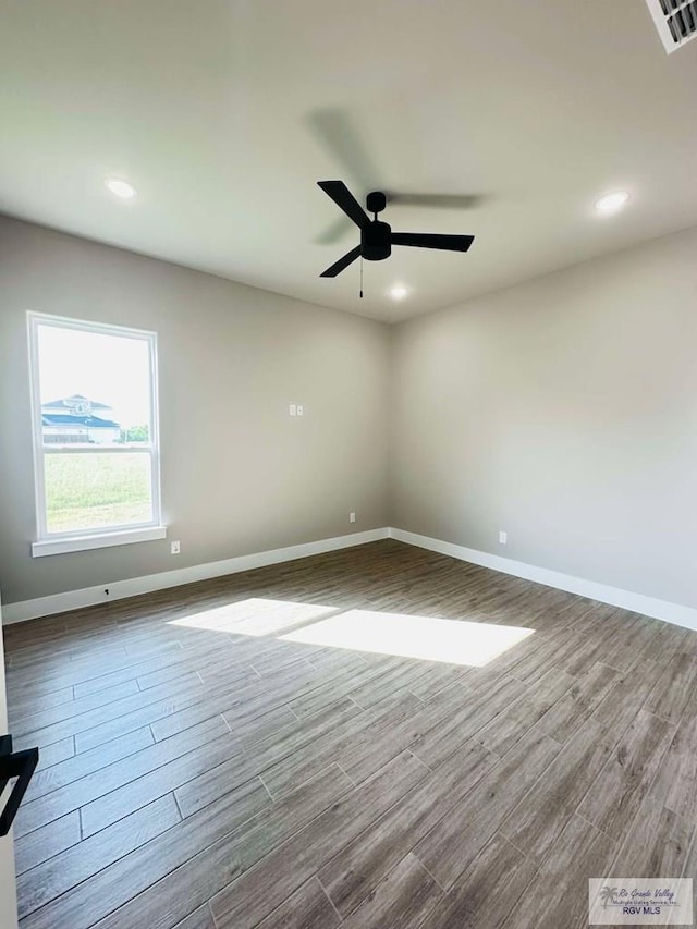 3414 Bryan Dr, Harlingen, TX 78550 - spare room with baseboards, dark wood finished floors, and recessed lighting
