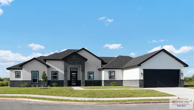 3414 Bryan Dr, Harlingen, TX 78550 - view of front of property featuring concrete driveway, a garage, stucco siding, and stone siding