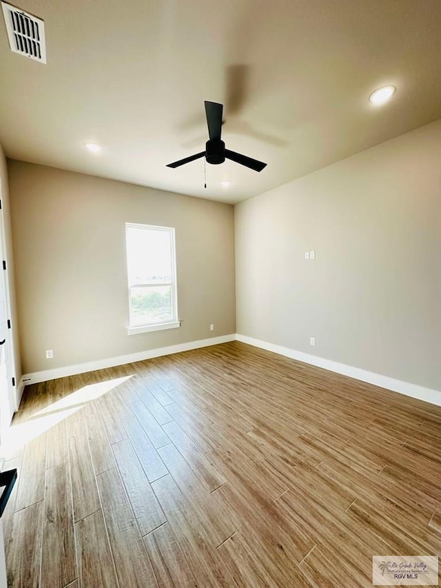 3414 Bryan Dr, Harlingen, TX 78550 - spare room featuring visible vents, wood finished floors, baseboards, and ceiling fan