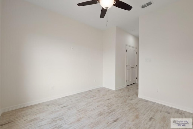 9817 Heights N, Harlingen, TX 78552 - unfurnished room with light wood finished floors, ceiling fan, and baseboards