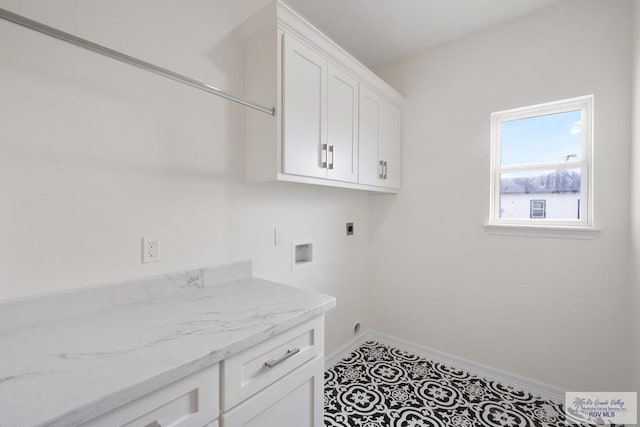 9817 Heights N, Harlingen, TX 78552 - laundry area featuring electric dryer hookup, cabinet space, baseboards, and hookup for a washing machine