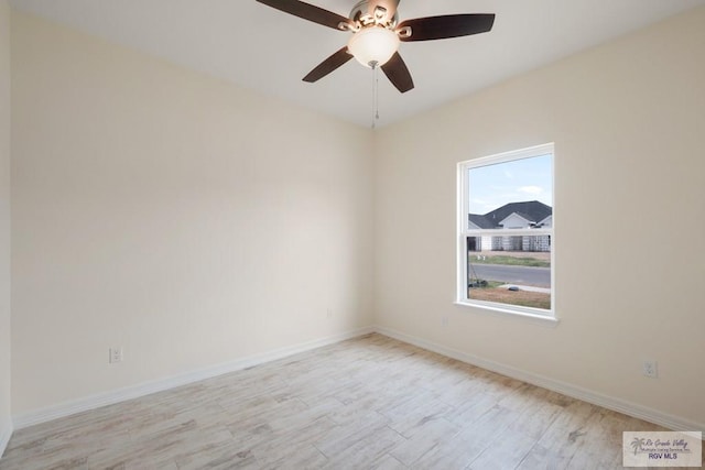 9817 Heights N, Harlingen, TX 78552 - empty room featuring light wood-type flooring, a ceiling fan, and baseboards