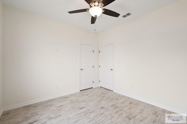 9817 Heights N, Harlingen, TX 78552 - unfurnished room with wood finished floors, a ceiling fan, and baseboards