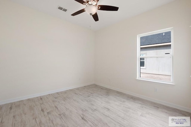 9817 Heights N, Harlingen, TX 78552 - empty room featuring wood finished floors, ceiling fan, and baseboards