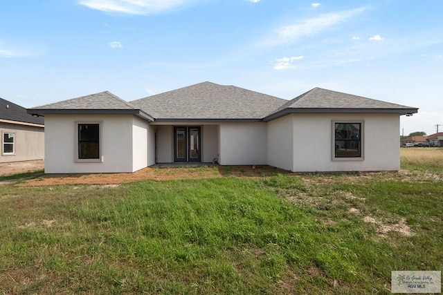 9817 Heights N, Harlingen, TX 78552 - view of front of home featuring a front lawn, french doors, and a shingled roof