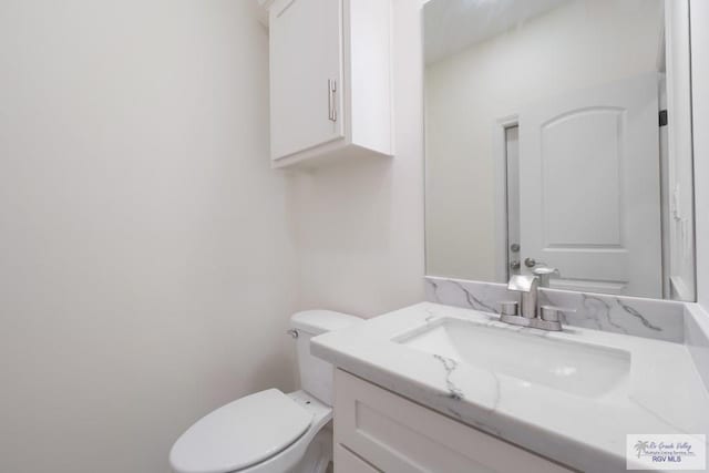 9817 Heights N, Harlingen, TX 78552 - half bathroom featuring toilet and vanity