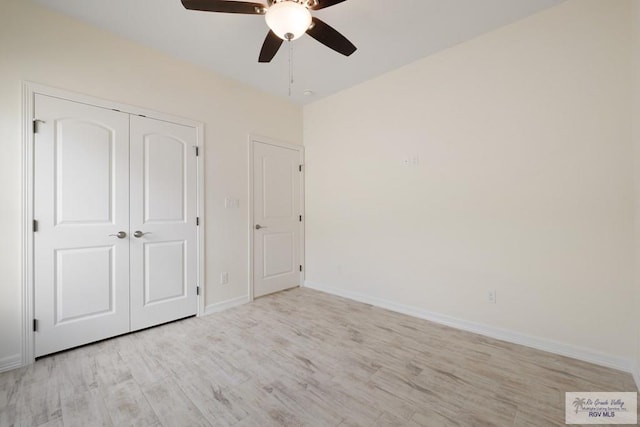 9817 Heights N, Harlingen, TX 78552 - unfurnished bedroom with light wood-type flooring, baseboards, a closet, and a ceiling fan