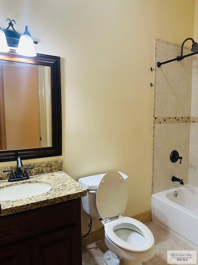 7232 Lago Viejo Blvd, Brownsville, TX 78520 - full bath with tile patterned flooring, toilet, bathing tub / shower combination, vanity, and baseboards