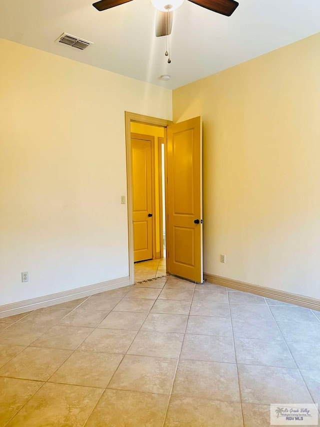 7232 Lago Viejo Blvd, Brownsville, TX 78520 - spare room featuring a ceiling fan, baseboards, and light tile patterned floors