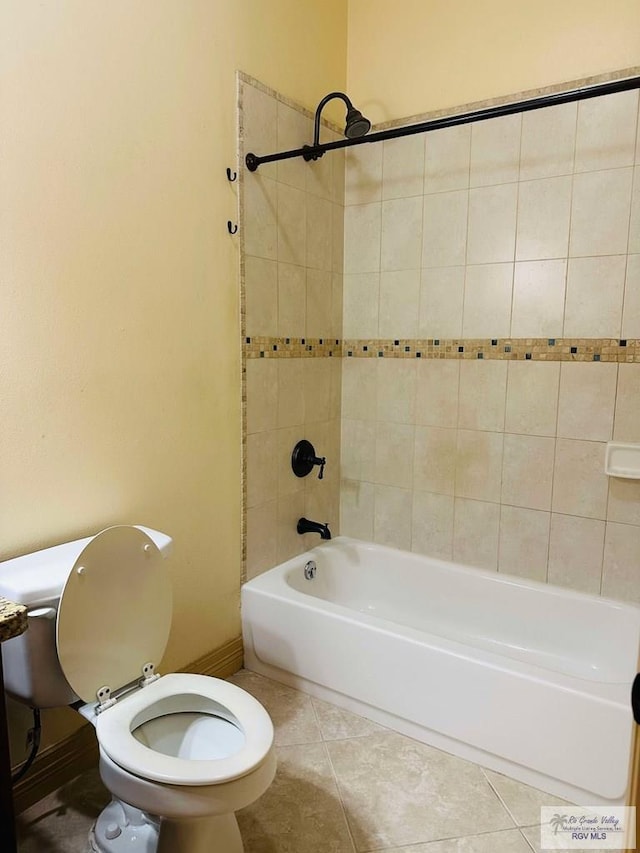 7232 Lago Viejo Blvd, Brownsville, TX 78520 - bathroom with tile patterned flooring, toilet, bathing tub / shower combination, and baseboards