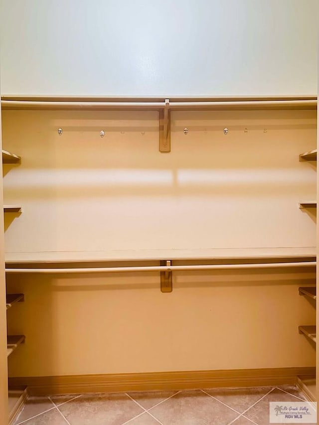7232 Lago Viejo Blvd, Brownsville, TX 78520 - walk in closet featuring light tile patterned flooring