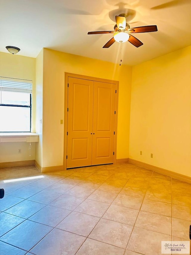 7232 Lago Viejo Blvd, Brownsville, TX 78520 - empty room featuring ceiling fan, light tile patterned floors, and baseboards