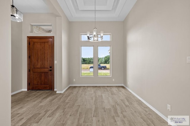 5112 Blackhawk Ave, Rio Grande City, TX 78582 - entryway with light wood finished floors, plenty of natural light, baseboards, and a notable chandelier