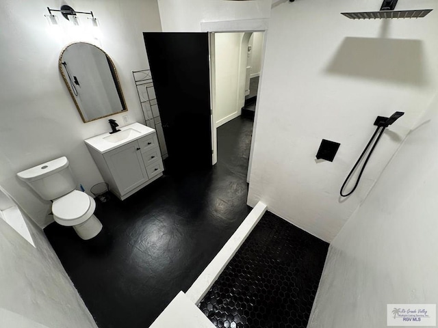 bathroom with toilet and vanity