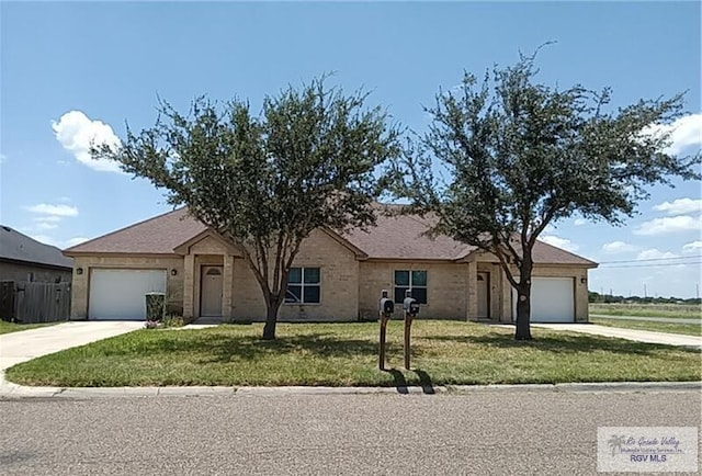 ranch-style house with a front yard and a garage