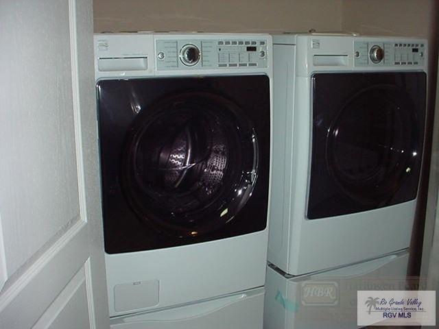 washroom featuring washer and clothes dryer