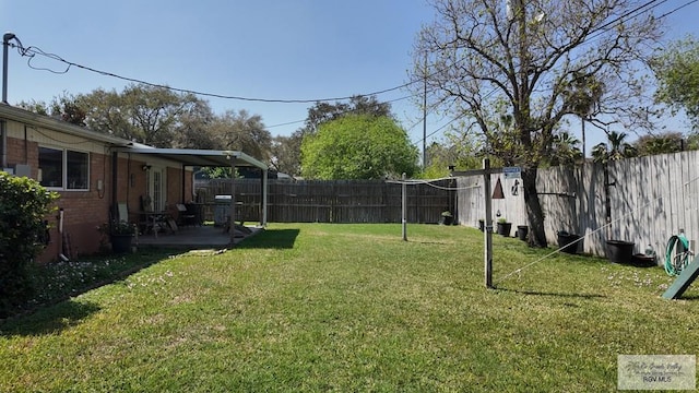 view of yard featuring a patio and a fenced backyard