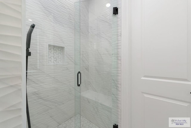 bathroom featuring an enclosed shower