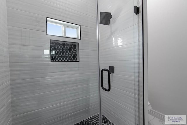 bathroom featuring an enclosed shower