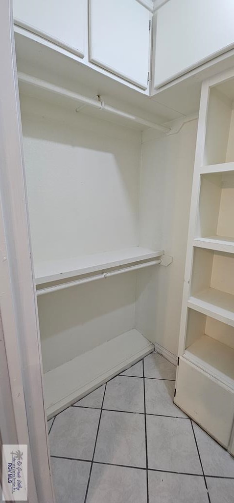 walk in closet featuring light tile patterned floors